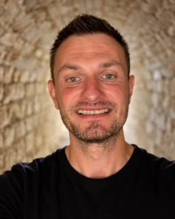 Bogdan Torcescu smiling in a black T-shirt